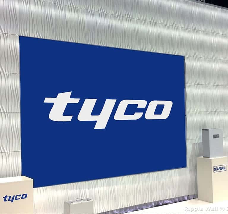 A trade show booth with a large blue