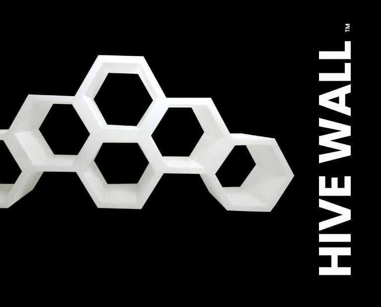 Geometric honeycomb-shaped wall art with hexagonal sections, labeled
