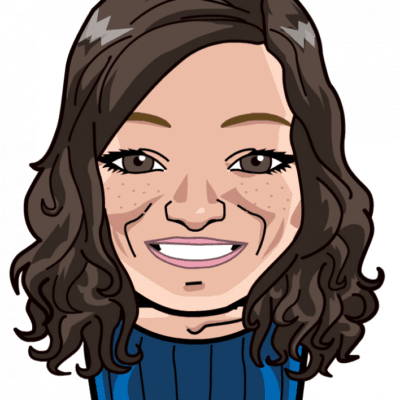 A digitally illustrated portrait of a woman with shoulder-length brown hair, freckles, and a friendly smile, wearing a blue top.